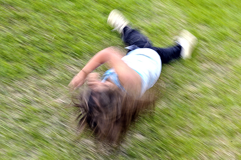 Rolling down a hill.