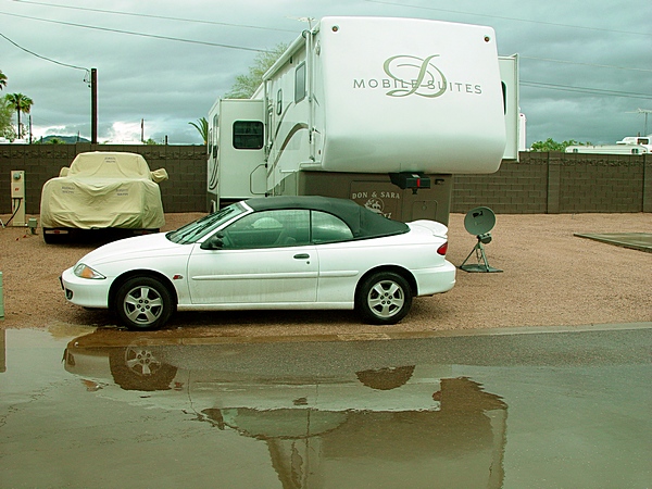 WE COVERED THE BIG TRUCK AND PARKED THE CAR ON THE WATERS EDGE