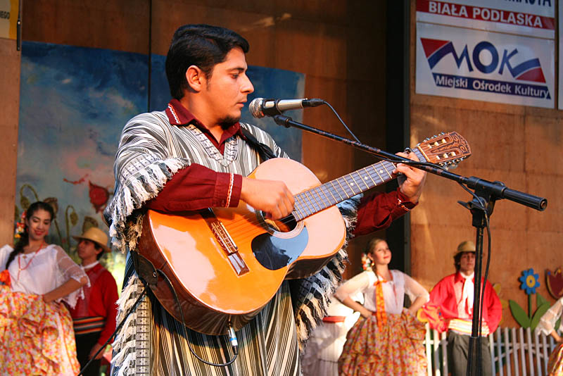 Singer playing on guitar