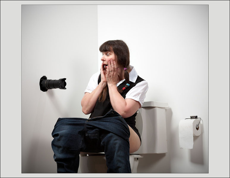 Woman sitting on toilet