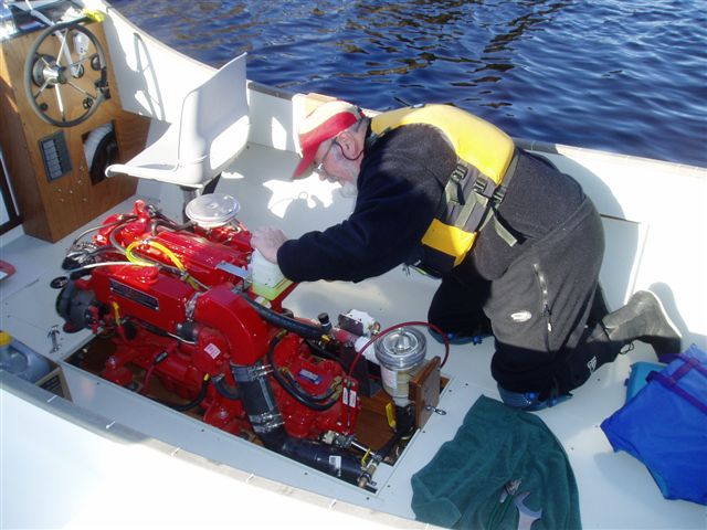 Engine warmup; ragging coolant overflow spray.