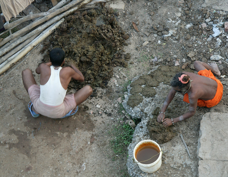 Forming cow chips for fuel, Varanasi.