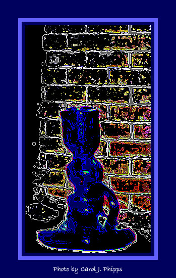 Blue glass vase on window sill.