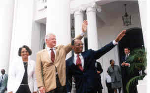 Former President Bill Clinton visits Haiti to commit support in fight against HIV/AIDS