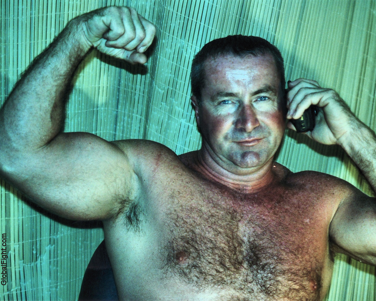 carolina jim talking phone flexed arm.jpg