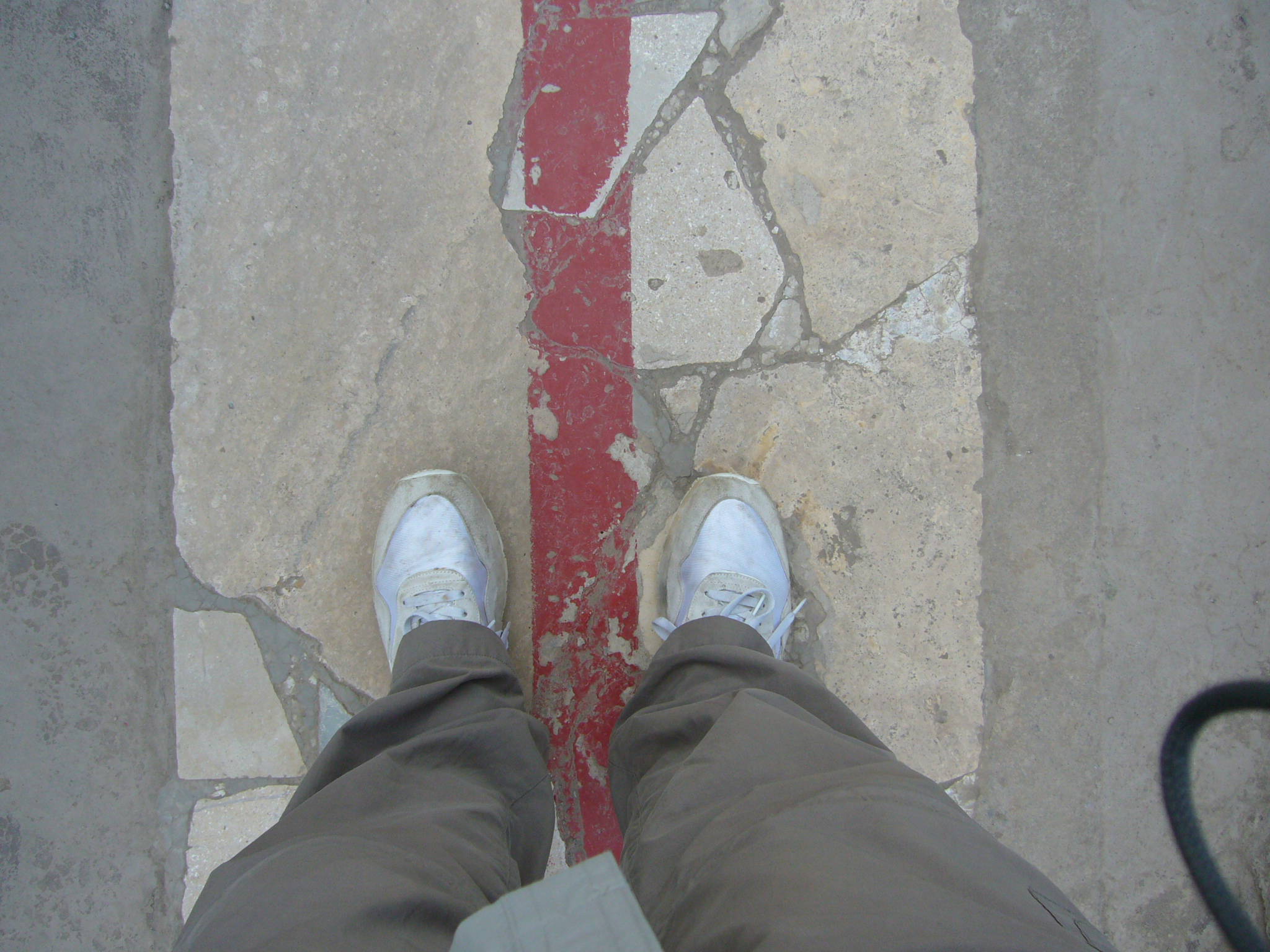 One foot on each side