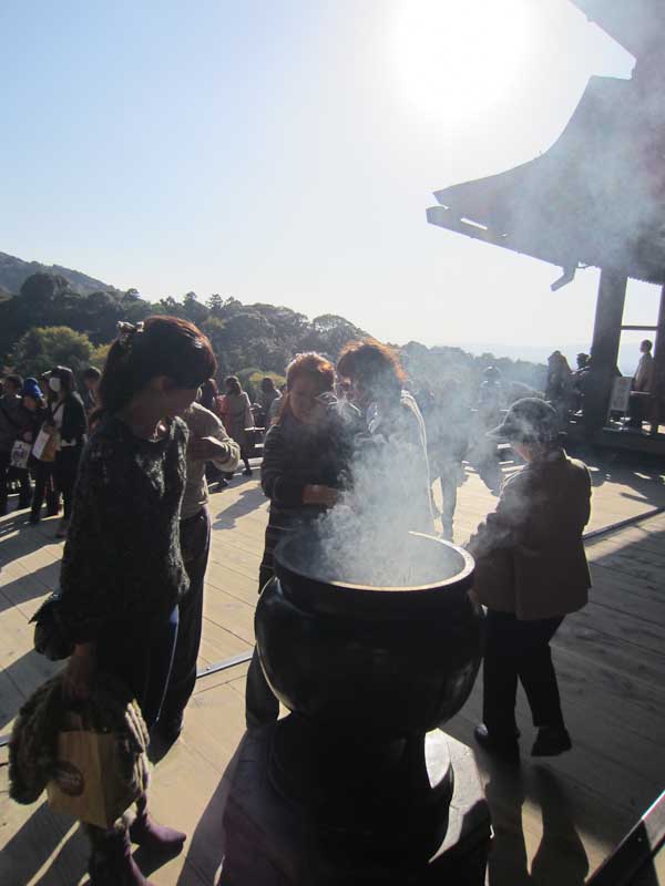 Gathering around the incense burner at Kiyomizudera Temple