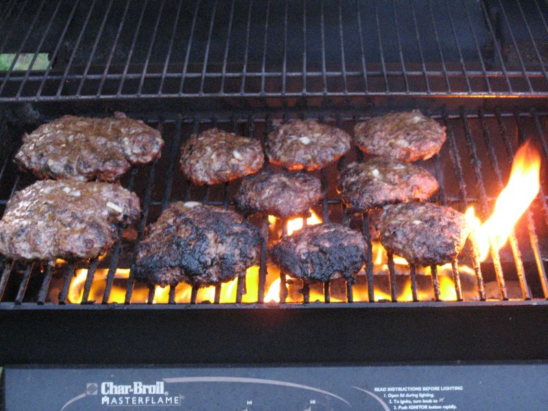In progress: my own Hamburger formula.  Ground Round, with Vidalia Onions and Creole Seasoning mixed in.  Slow-grilled on low, in a timed 4-flip process taking 24 minutes (8 minutes per side, then 4 minutes per side).  Well Done, Juicy, and DEE-LICIOUS!!!!!