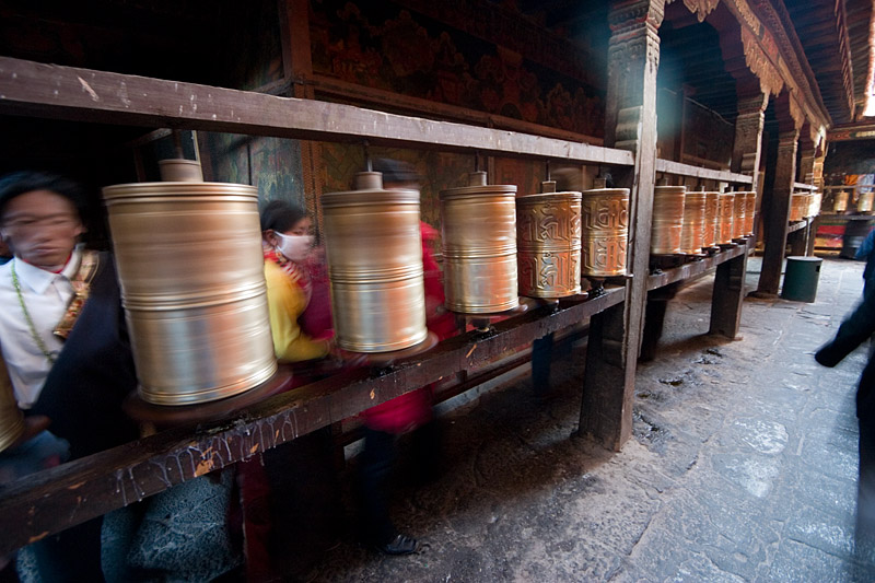 Prayer wheels on the outside of the walkway.
