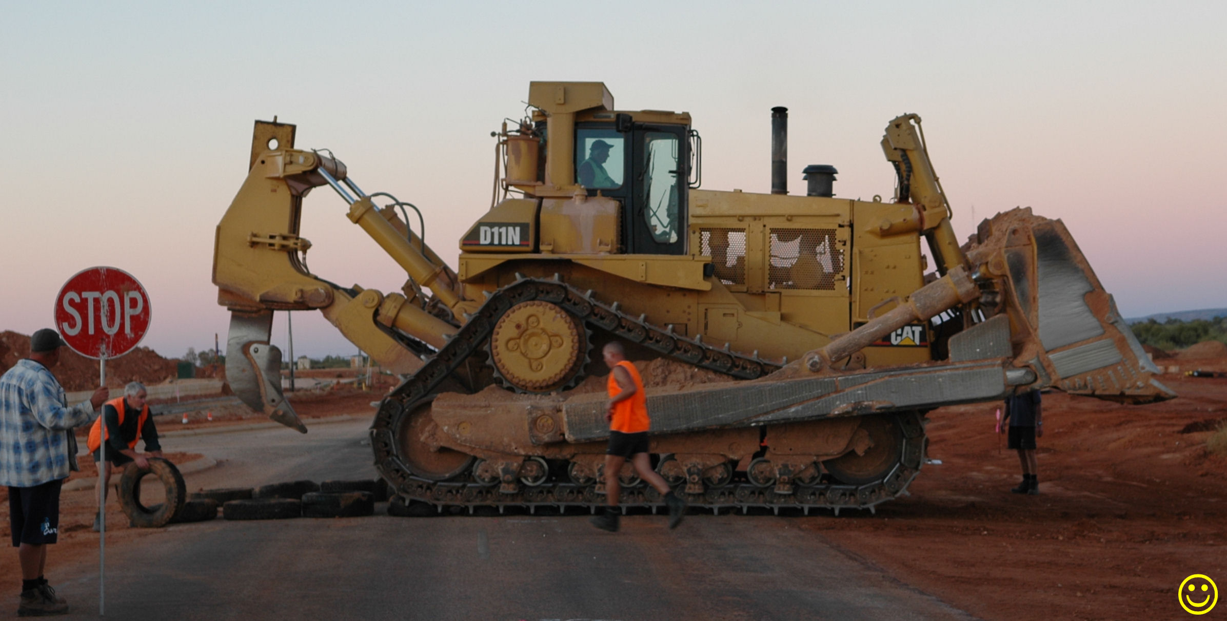 Why did the bulldozer cross the road?