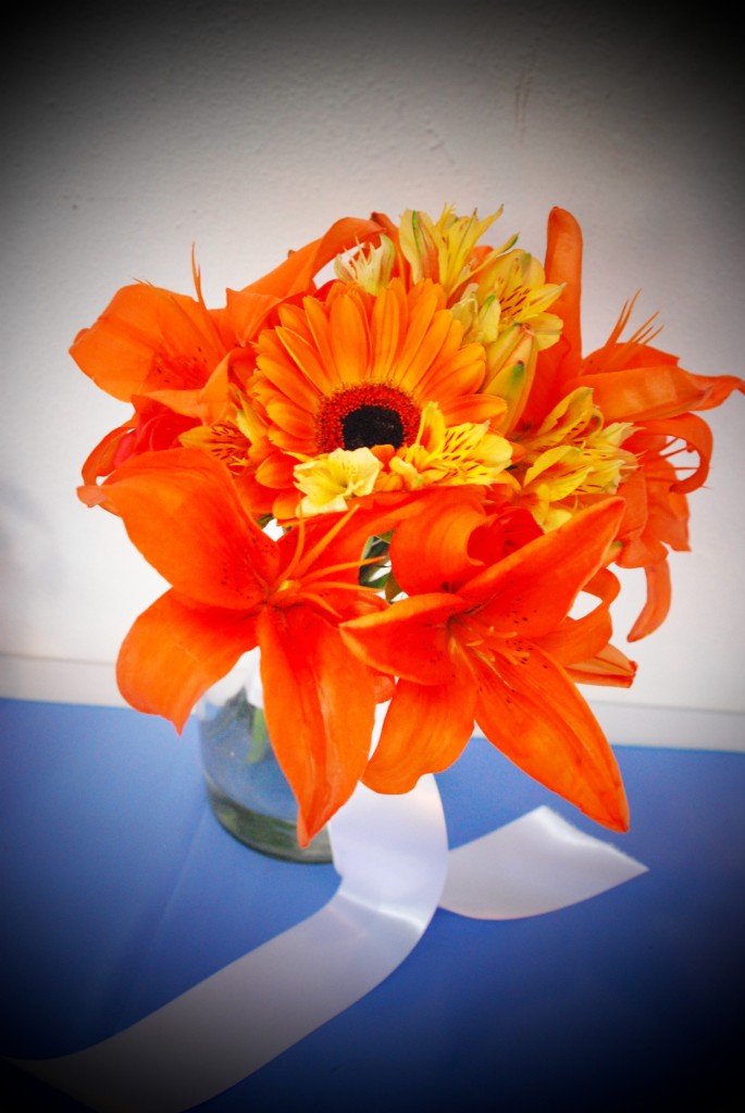Orange tropical lilies, orange gerber daisies, and yellow alstroemeria. Photo by Kate Bahnsen