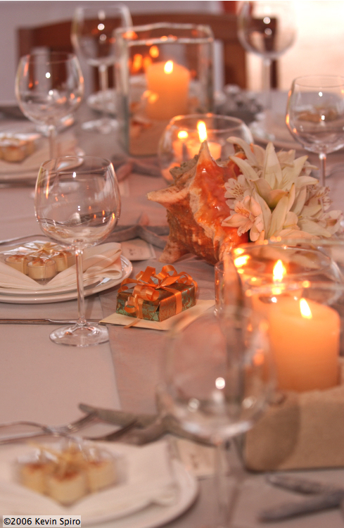 Scattered Candles with conch shell centerpiece - Photo by Kevyn Spiro