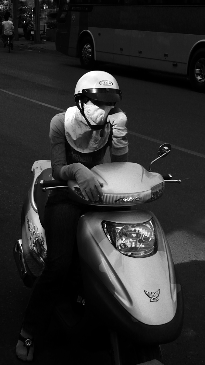 Cyclist at rest, Saigon, Vietnam, 2008