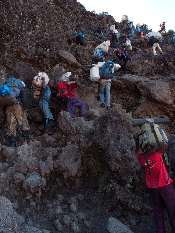 Porters climbing the wall