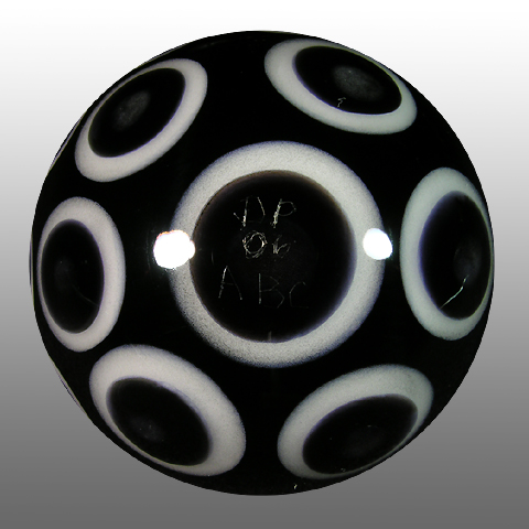 Ds signature disc flip tech in a colorful triangle pattern around the E is juxtaposed against the black&white dotted backside.
