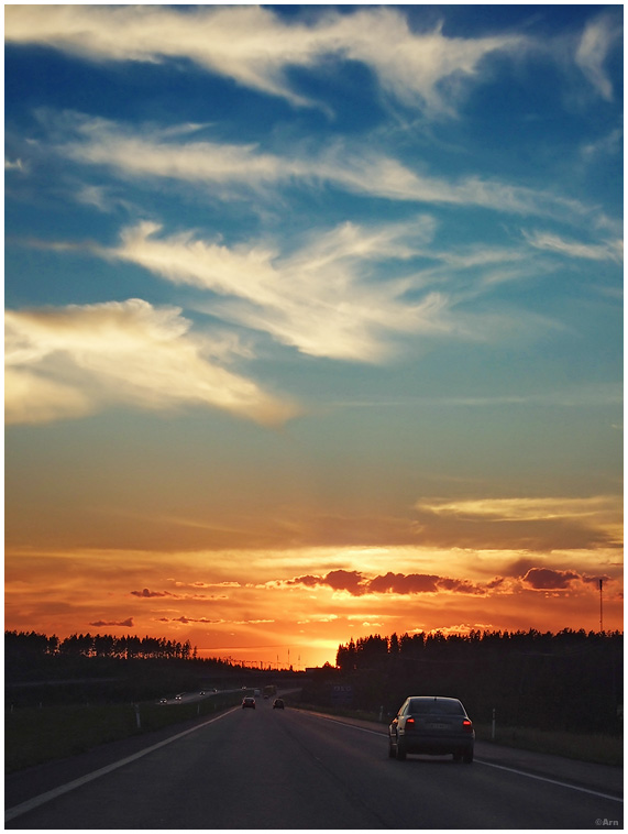 driving towards sunset