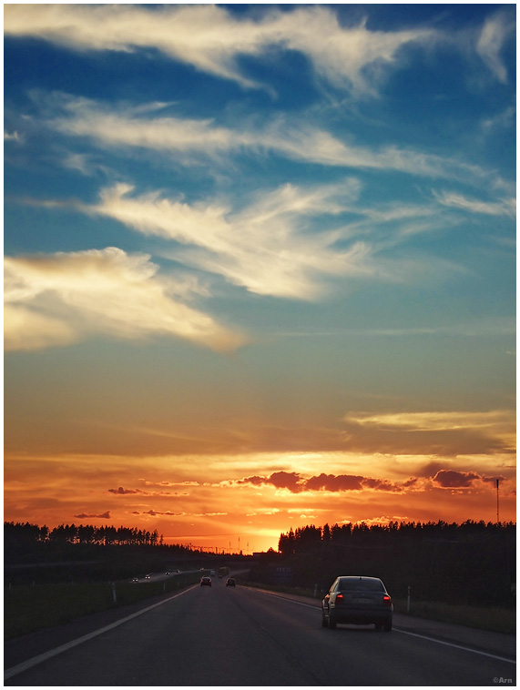 driving towards sunset