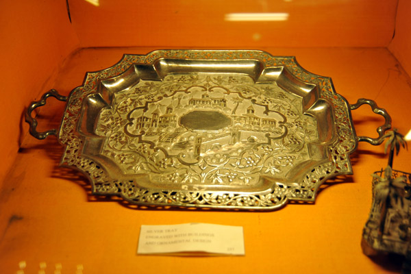 Silver tray engraved with buildings and ornamental design