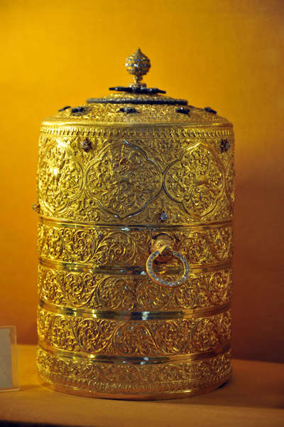 Gold Tiffin box with trays carved with flora and fauna