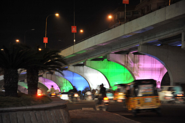 Telugu Talli Flyover illuminated in color at night
