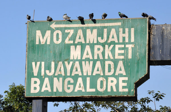 Road sign for the Mozamjahi Market and Bangalore