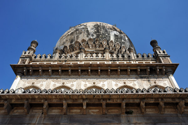 Most sources, except the plaque on the tomb, name Abdullah Qutb Shah as the 7th Qutb Shahi Ruler
