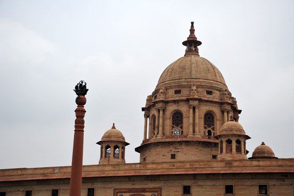 Two identical domed buildings housing the Ministries face each other across the Rajpath