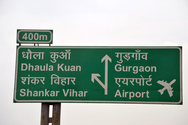 Road sign for Delhi Airport and the city of Gurgaon