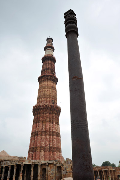 The Iron Pillar of Delhi with the Qutb Minar