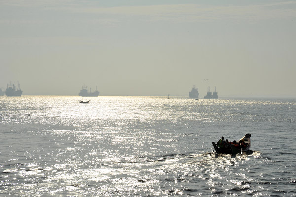 Freighers moored in the marine estuary off Yangon