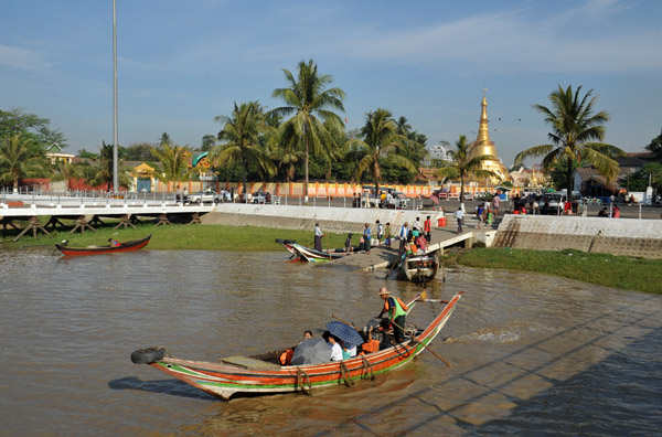 Small wooden boats used to ferry people across the Yangon River