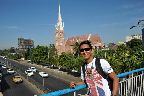 Dennis on the Bagyoke Aung San overpass with Holy Trinity Cathedral