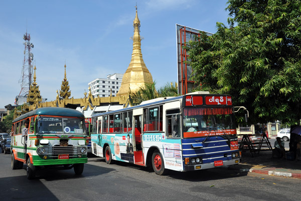 Buses on Mahabandoola Road in front of Sule Paya (Pagoda)