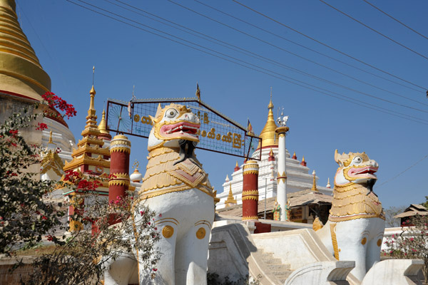 Guardian lions at the restored pagoda of Tada-U