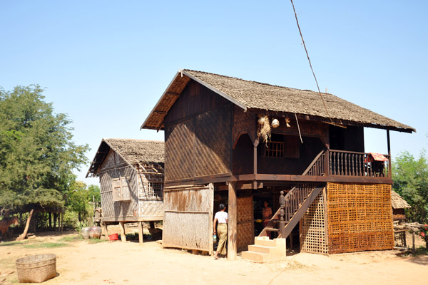 Traditonal houses made of panels of woven palm fronds, Inwa