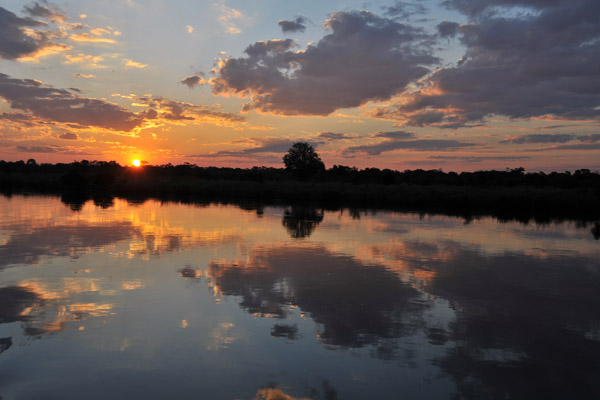 Sunset with clouds reflecting in the Kafue River