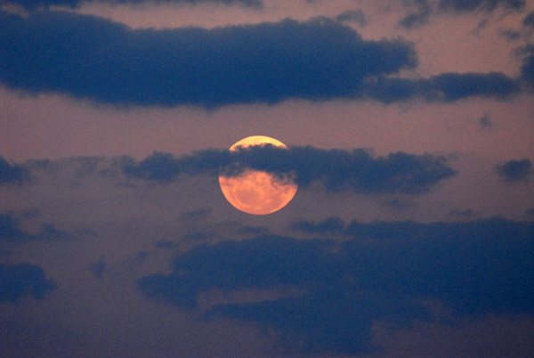 Moon and clouds over Kafue National Park