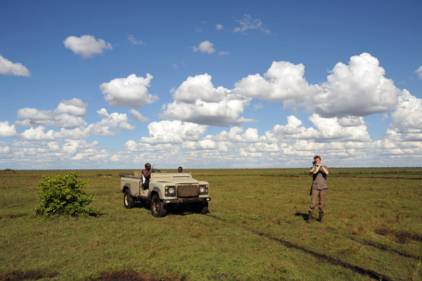 Landcruiser on the flat grassland at the edge of the Bangweulu Swamps