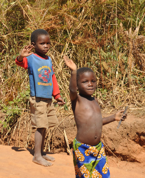 Friendly Zambian boys waving as we pass