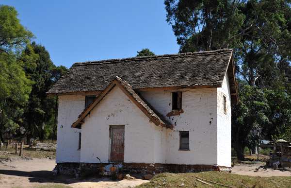 There are a number of sturdy houses along the road of Shiwa Ngandu Estate