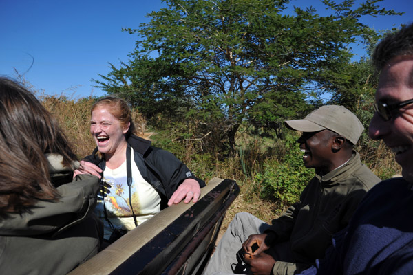 Laughing with a guide on the way to the airport