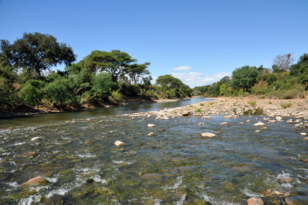 Fording the Chongwe River in a Land Cruiser safari vehicle