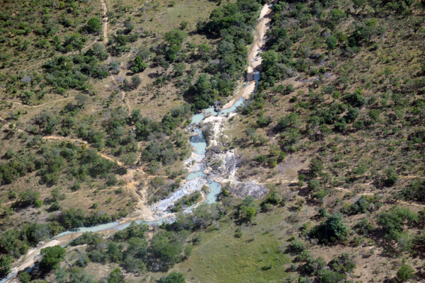 Overflying a rocky stream 25 minutes after departing Livingstone