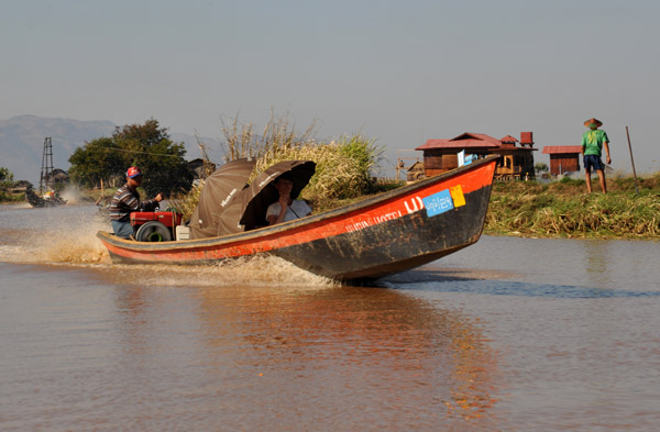 Motorized long boat commonly used on Inle Lake