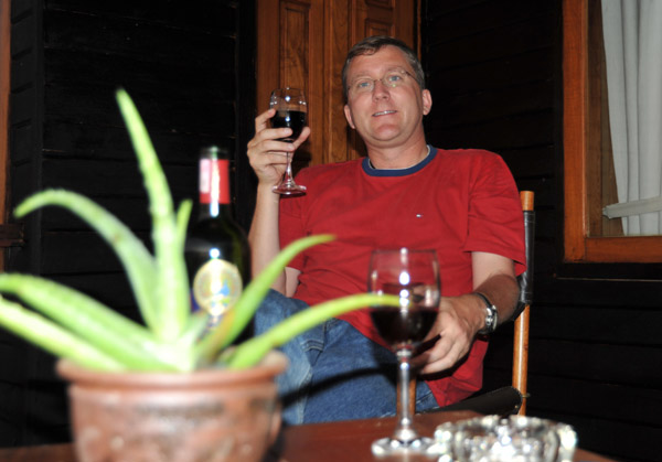 Enjoying a glass of Myanmar red wine on the terrace at Myanmar Treasure Resort, Inle Lake
