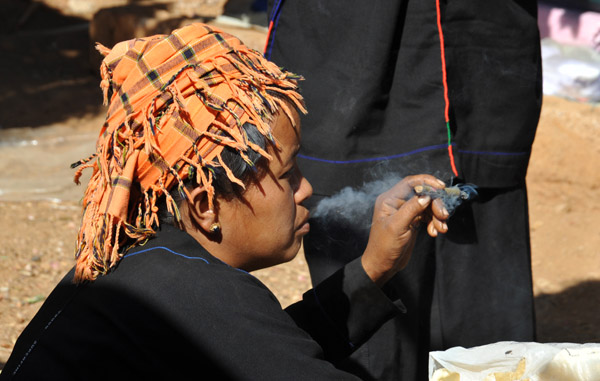 Hill Tribe woman smoking a traditional Burmese cheroot, Indein