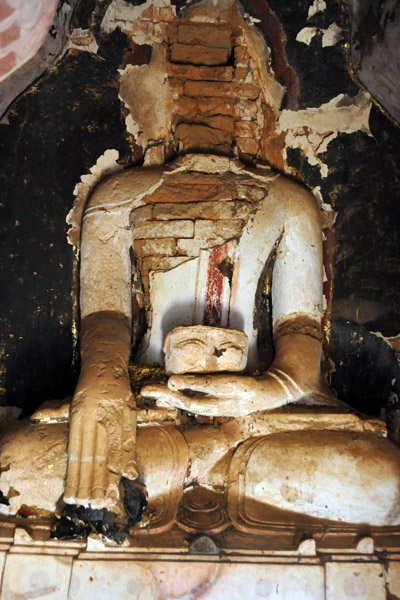 Buddha with his face in his hand