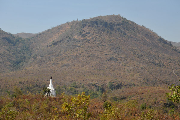A lone white stupa off on its own by the hills around Shwe Inn Thein