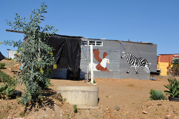 Tin shack painted with Zebra and Fish Eagle near Windhoek