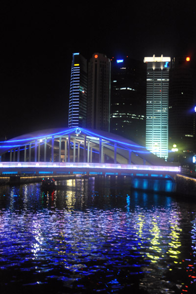 Bridge over the Singapore River illuminated in blue